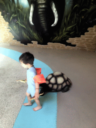 Max with a statue of a Turtle at the Maji Springs swimming pool at Karibu Town at the Safari Resort at the Safaripark Beekse Bergen