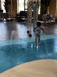 Max with a fountain at the Maji Springs swimming pool at Karibu Town at the Safari Resort at the Safaripark Beekse Bergen