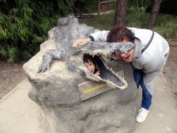 Miaomiao and Max with a crocodile statue in front of the Hippopotamus and Crocodile enclosure at the Safaripark Beekse Bergen