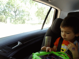 Max in the car at the Safaripark Beekse Bergen, during the Autosafari