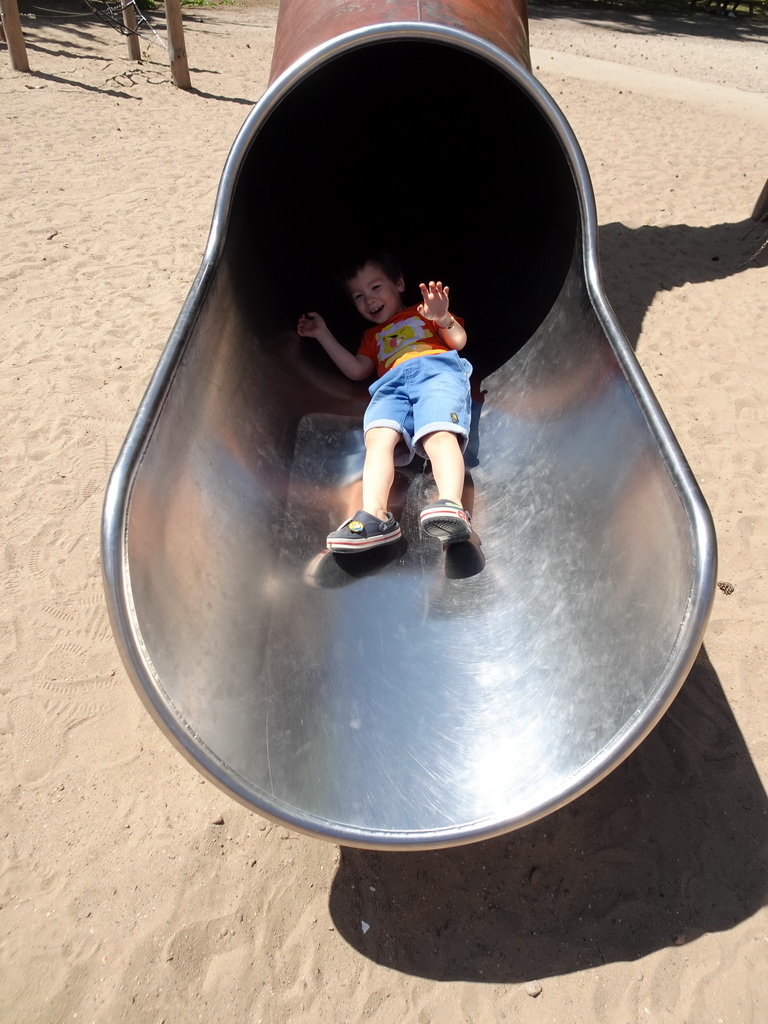 Max on the slide at the playground near the Kongo restaurant at the Safaripark Beekse Bergen