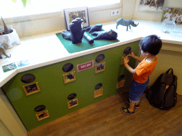 Max playing a puzzle at the Wildlife Foundation building at the Safaripark Beekse Bergen