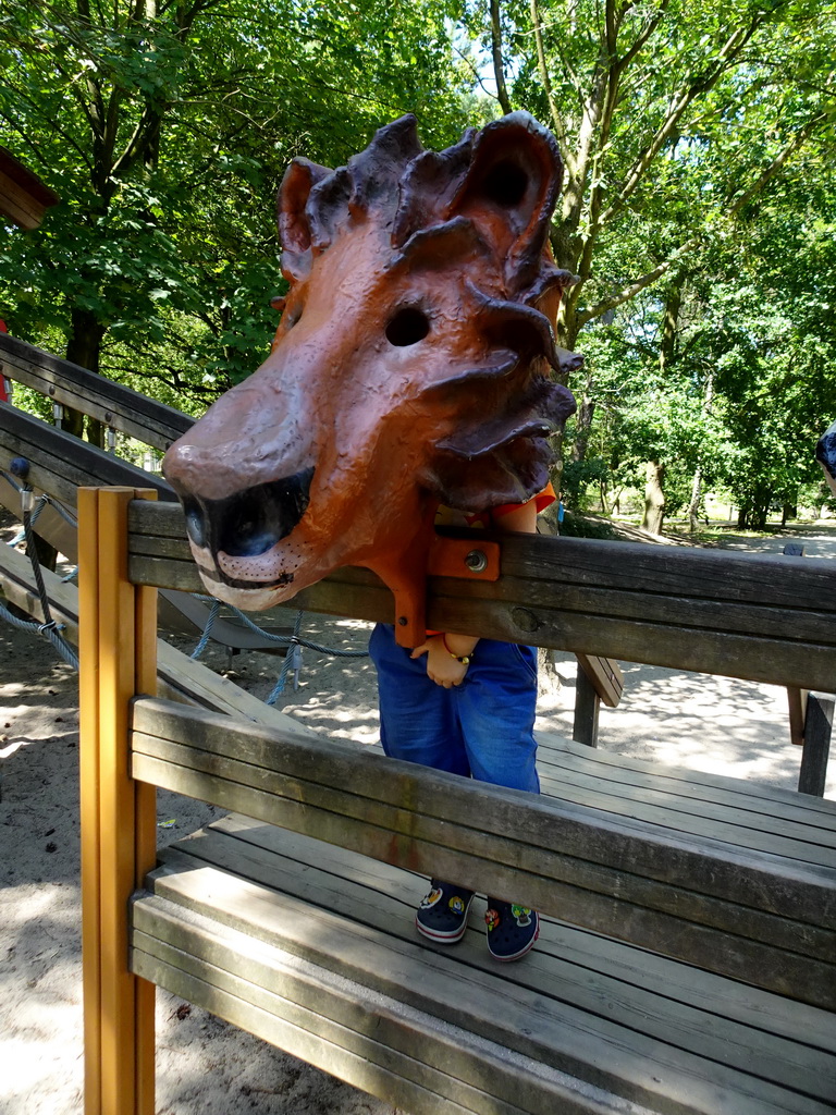 Max with a Lion mask at the playground near the Ranger Camp at the Safaripark Beekse Bergen