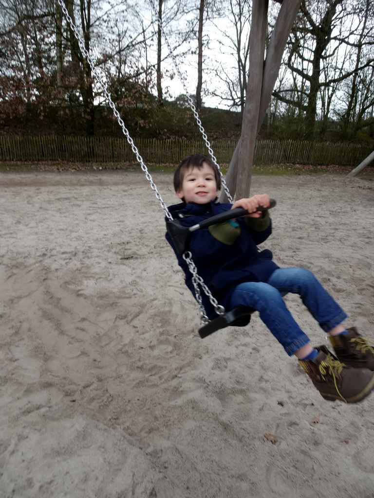 Max on the swing at the playground at the Afrikadorp village at the Safaripark Beekse Bergen