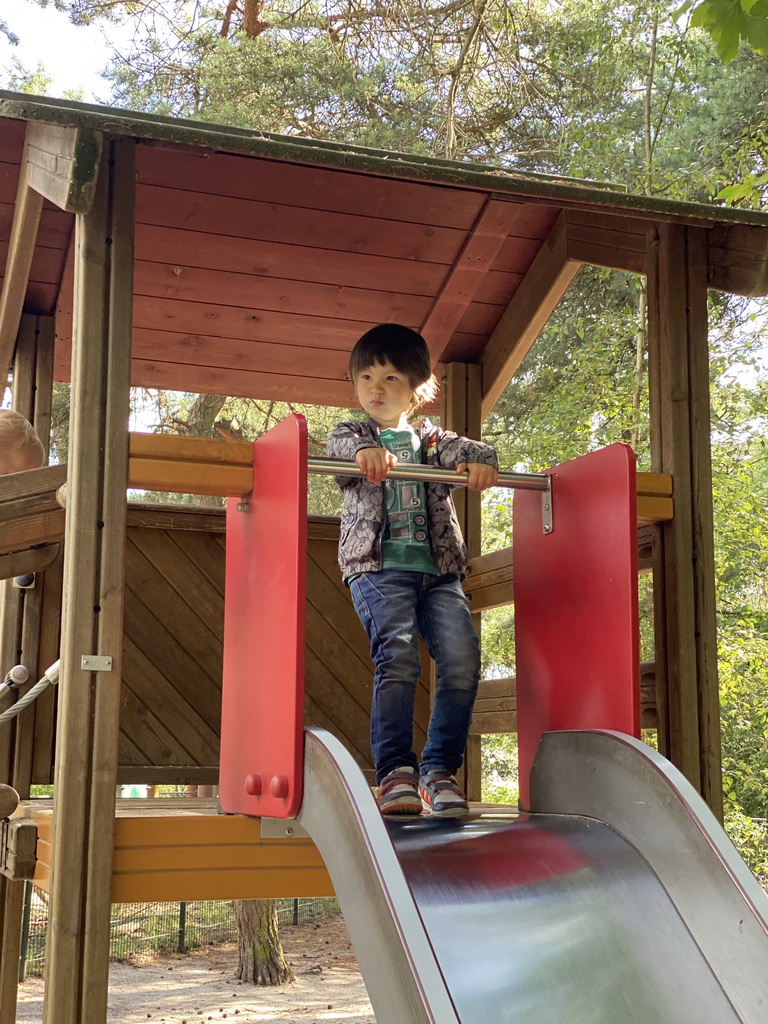 Max on the slide at the playground near the Elephant enclosure at the Safaripark Beekse Bergen