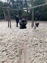 Max on a swing at the playground of the Afrikadorp village at the Safaripark Beekse Bergen