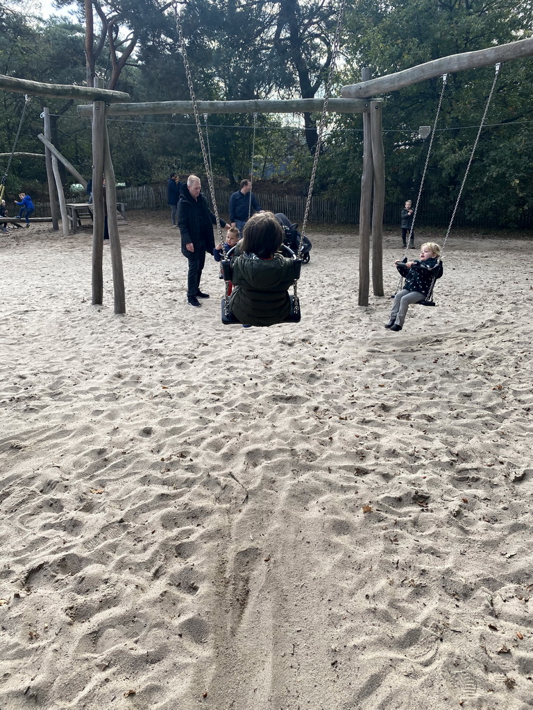 Max on a swing at the playground of the Afrikadorp village at the Safaripark Beekse Bergen