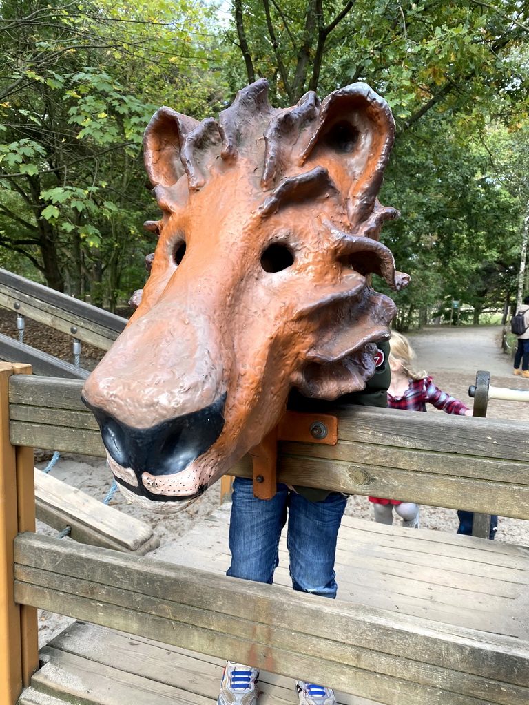 Max with a lion mask at the playground near the Elephant enclosure at the Safaripark Beekse Bergen