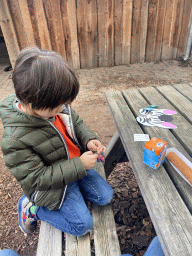 Max playing with toys at the terrace of the restaurant at the Safariplein square at the Safaripark Beekse Bergen