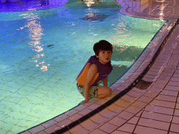 Max at the swimming pool at the Landal Miggelenberg holiday park, by night