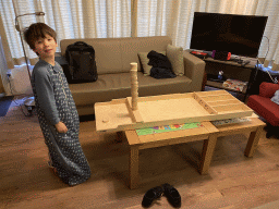 Max playing shuffleboard in the living room of our holiday home at the Landal Miggelenberg holiday park