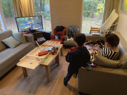 Miaomiao and Max playing the Nintendo Switch game `Hyrule Warriors: Age of Calamity` in the living room of our holiday home at the Landal Miggelenberg holiday park