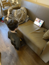 Max watching iPad in the living room of our holiday home at the Landal Miggelenberg holiday park