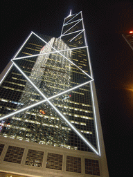 The Bank of China Tower with a reflection of the Cheung Kong Centre, by night