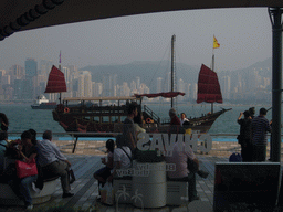 Boat in Victoria Harbour and the skyline of Hong Kong, viewed from a terrace of a restaurant at the Avenue of Stars