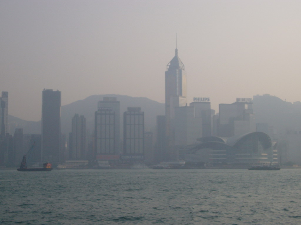 Boats in Victoria Harbour and the skyline of Hong Kong with the Central Plaza building and the Hong Kong Convention and Exhibition Centre, viewed from the Avenue of Stars