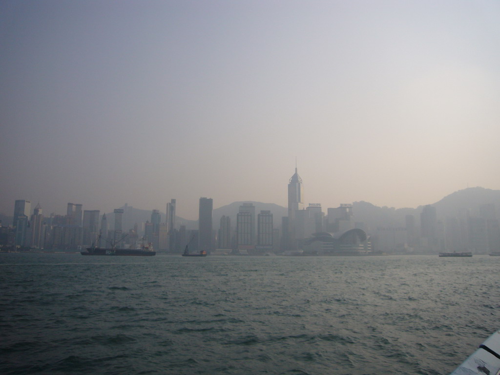 Boats in Victoria Harbour and the skyline of Hong Kong with the Central Plaza building and the Hong Kong Convention and Exhibition Centre, viewed from the Avenue of Stars