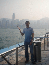 Tim at the Avenue of Stars, with a view on Victoria Harbour and the skyline of Hong Kong with the Central Plaza building and the Hong Kong Convention and Exhibition Centre