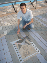 Tim with the hand prints of Jackie Chan at the Avenue of Stars