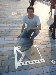 Tim with the hand prints of Bruce Lee at the Avenue of Stars