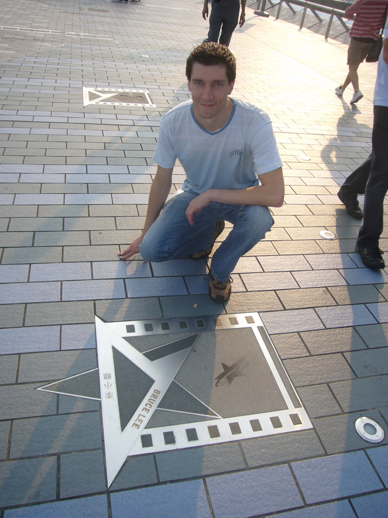 Tim with the hand prints of Bruce Lee at the Avenue of Stars