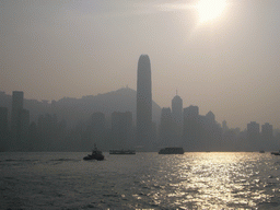 Boats in Victoria Harbour and the skyline of Hong Kong with the Two International Finance Centre and Victoria Peak, viewed from the Avenue of Stars