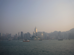 Boats in Victoria Harbour and the skyline of Hong Kong with the Central Plaza building and the Hong Kong Convention and Exhibition Centre