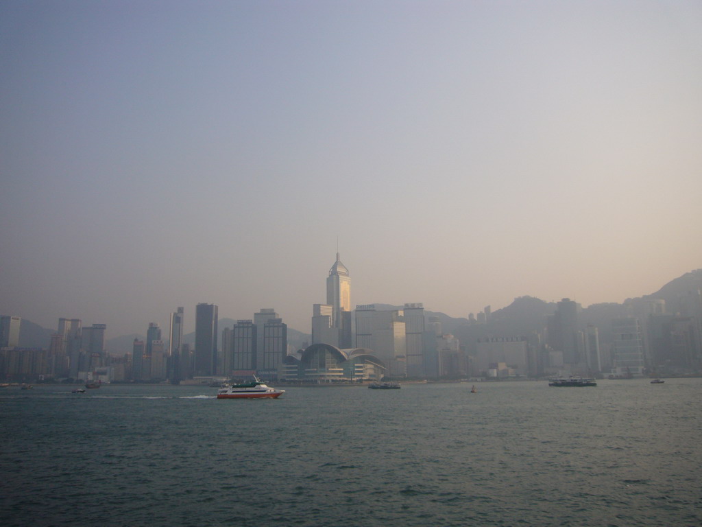 Boats in Victoria Harbour and the skyline of Hong Kong with the Central Plaza building and the Hong Kong Convention and Exhibition Centre