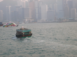 Boats in Victoria Harbour and the skyline of Hong Kong, viewed from the Star Ferry from Kowloon to Hong Kong Island