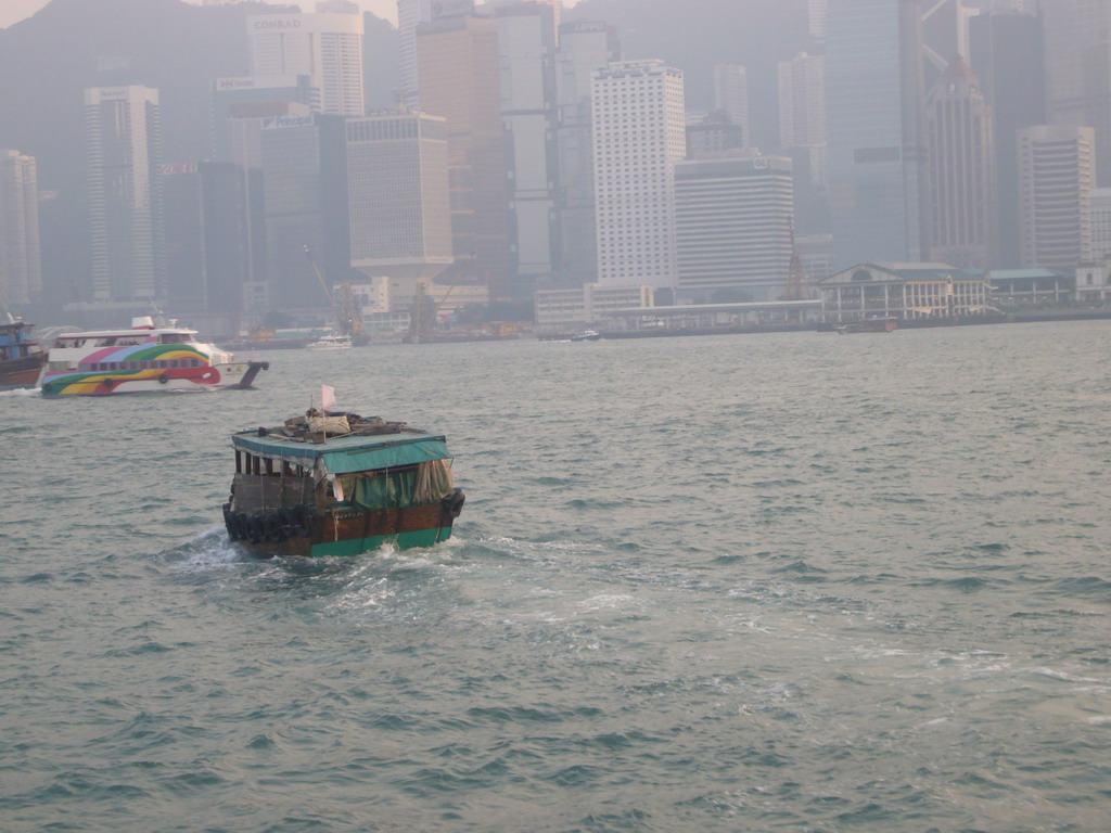Boats in Victoria Harbour and the skyline of Hong Kong, viewed from the Star Ferry from Kowloon to Hong Kong Island