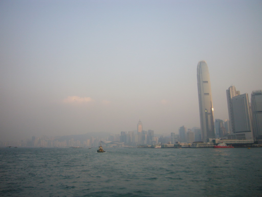 Boats in Victoria Harbour and the skyline of Hong Kong with the Two International Finance Centre, viewed from the Star Ferry from Kowloon to Hong Kong Island