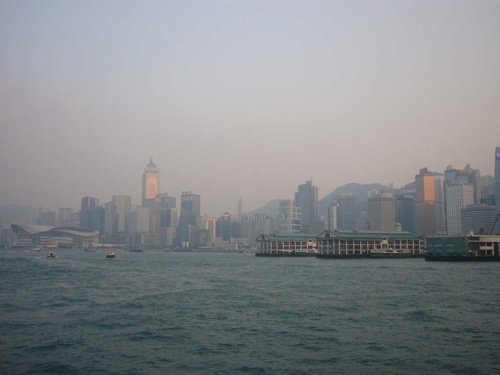 Victoria Harbour and the skyline of Hong Kong with the Central Plaza building, the Hong Kong Convention and Exhibition Centre and the Central Ferry Piers, viewed from the Star Ferry from Kowloon to Hong Kong Island