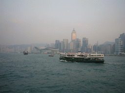 Boats in Victoria Harbour and the skyline of Hong Kong with the Central Plaza building and the Hong Kong Convention and Exhibition Centre, viewed from the Star Ferry from Kowloon to Hong Kong Island