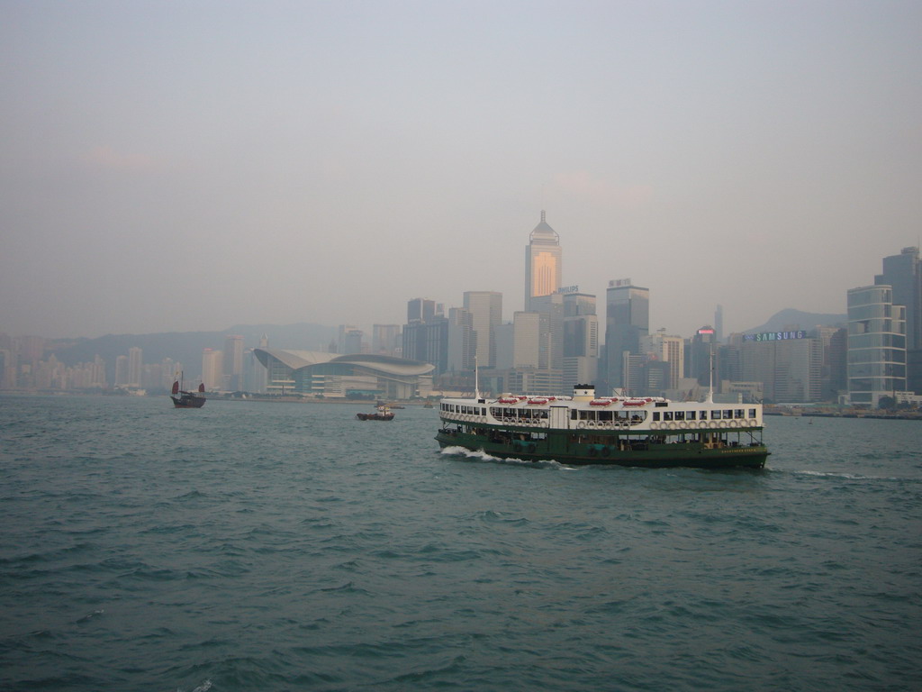 Boats in Victoria Harbour and the skyline of Hong Kong with the Central Plaza building and the Hong Kong Convention and Exhibition Centre, viewed from the Star Ferry from Kowloon to Hong Kong Island