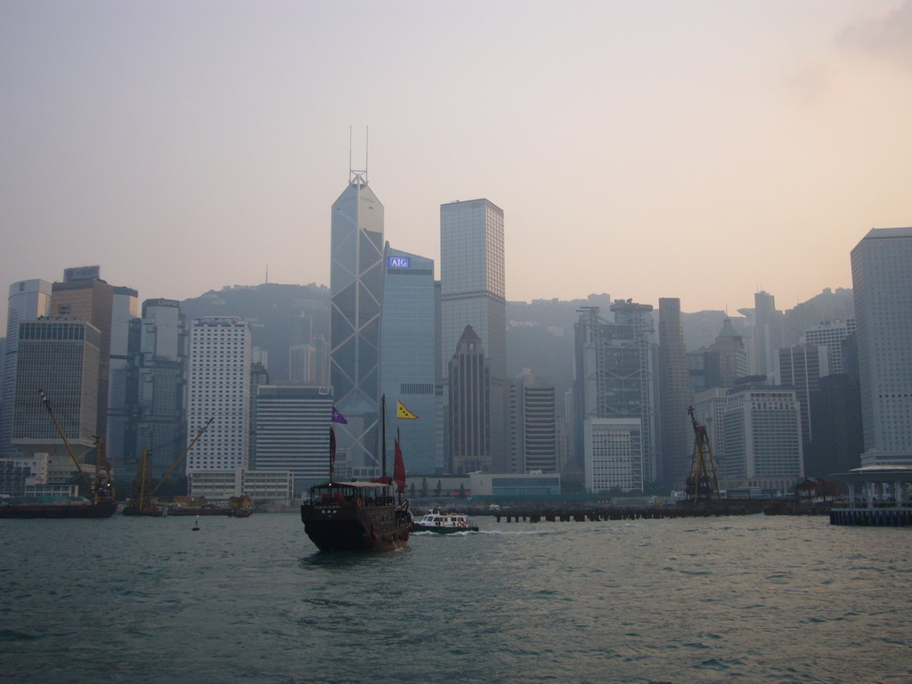 Boats in Victoria Harbour and the skyline of Hong Kong with the Bank of China Tower, viewed from the Star Ferry from Kowloon to Hong Kong Island