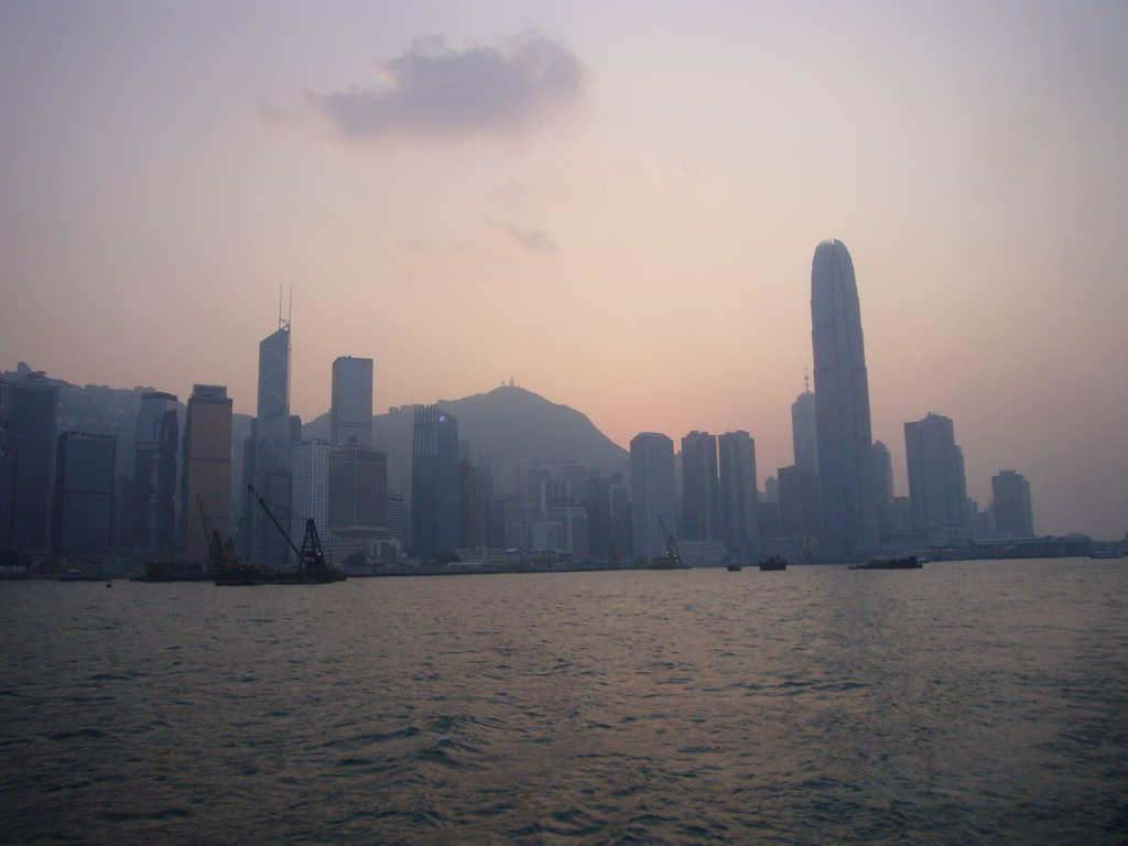 Boats in Victoria Harbour and the skyline of Hong Kong with the Bank of China Tower, the Two International Finance Centre and Victoria Peak, viewed from the Star Ferry from Kowloon to Hong Kong Island