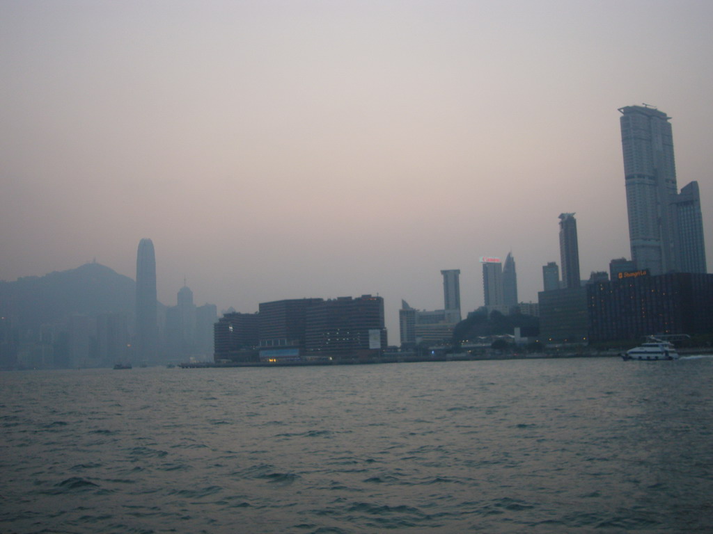 Victoria Harbour and the skyline of Hong Kong with the Two International Finance Centre and Victoria Peak, viewed from the Star Ferry from Hong Kong Island to Kowloon, at sunset