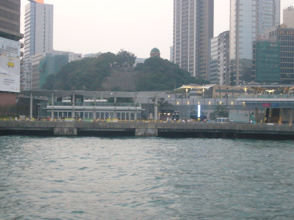 Victoria Harbour and the skyline of Kowloon with the Signal Hill Garden, viewed from the Star Ferry from Hong Kong Island to Kowloon, at sunset