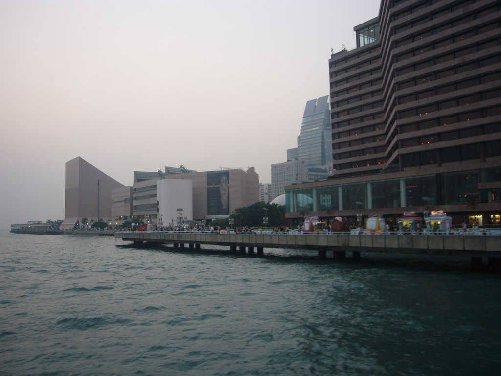 Victoria Harbour and the skyline of Kowloon with the Hong Kong Museum of Art, viewed from the Star Ferry from Hong Kong Island to Kowloon, at sunset
