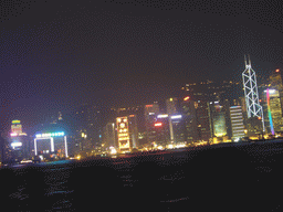 Victoria Harbour and the skyline of Hong Kong with the Bank of China Tower, viewed from the Avenue of Stars, during the `A Symphony of Lights` light and sound show, by night