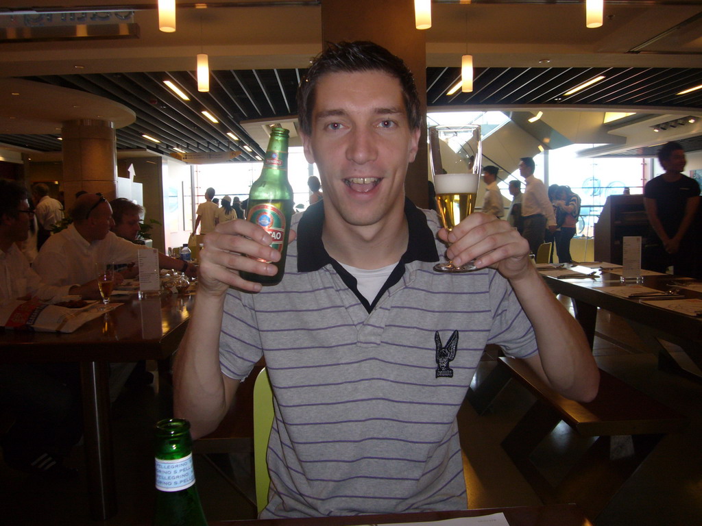 Tim with a Tsingtao beer at a restaurant at Peak Tower