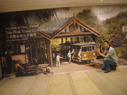 Tim with a poster of the Peak Tram Historical Gallery, at Victoria Peak