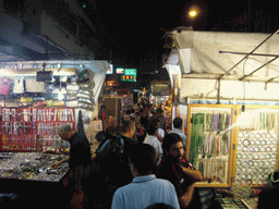 Market stalls in a street at Kowloon, by night