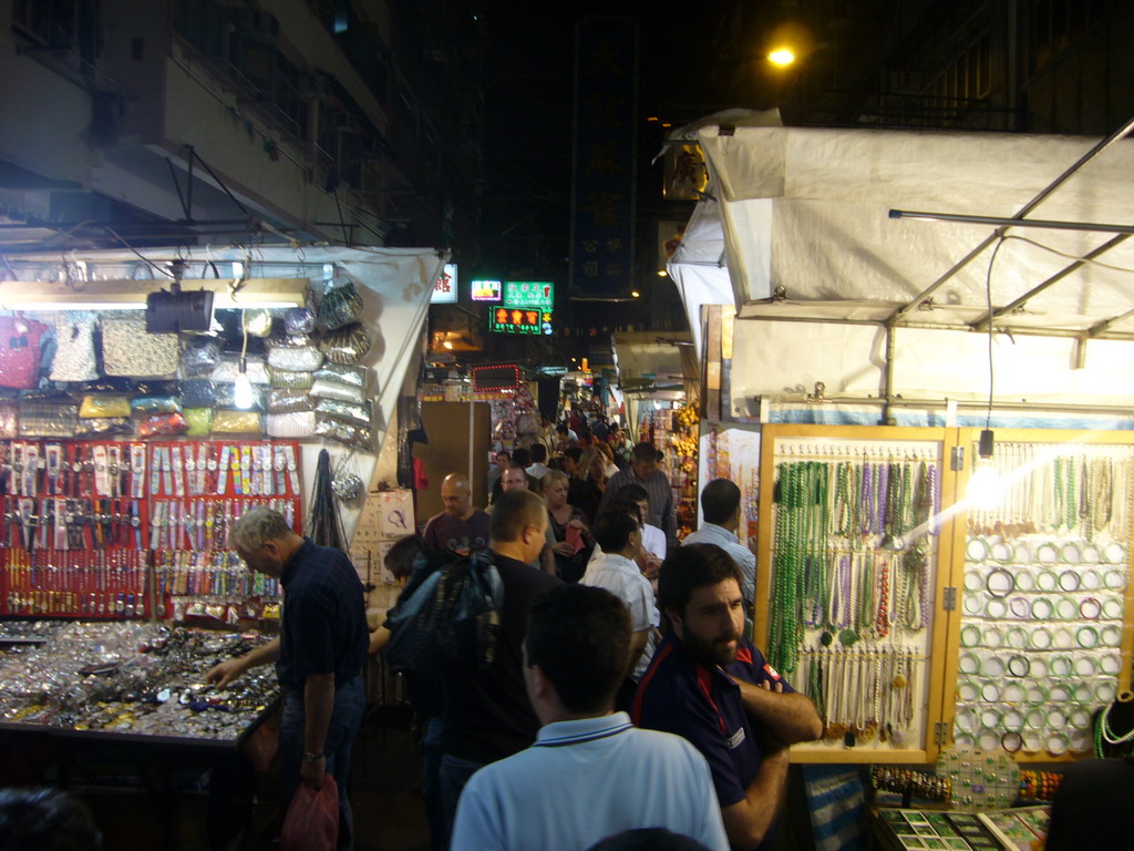 Market stalls in a street at Kowloon, by night