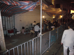 Street musicians in a street at Kowloon, by night