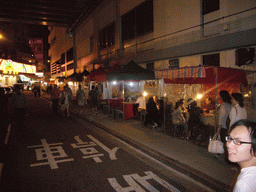 Market stalls in a street at Kowloon, by night