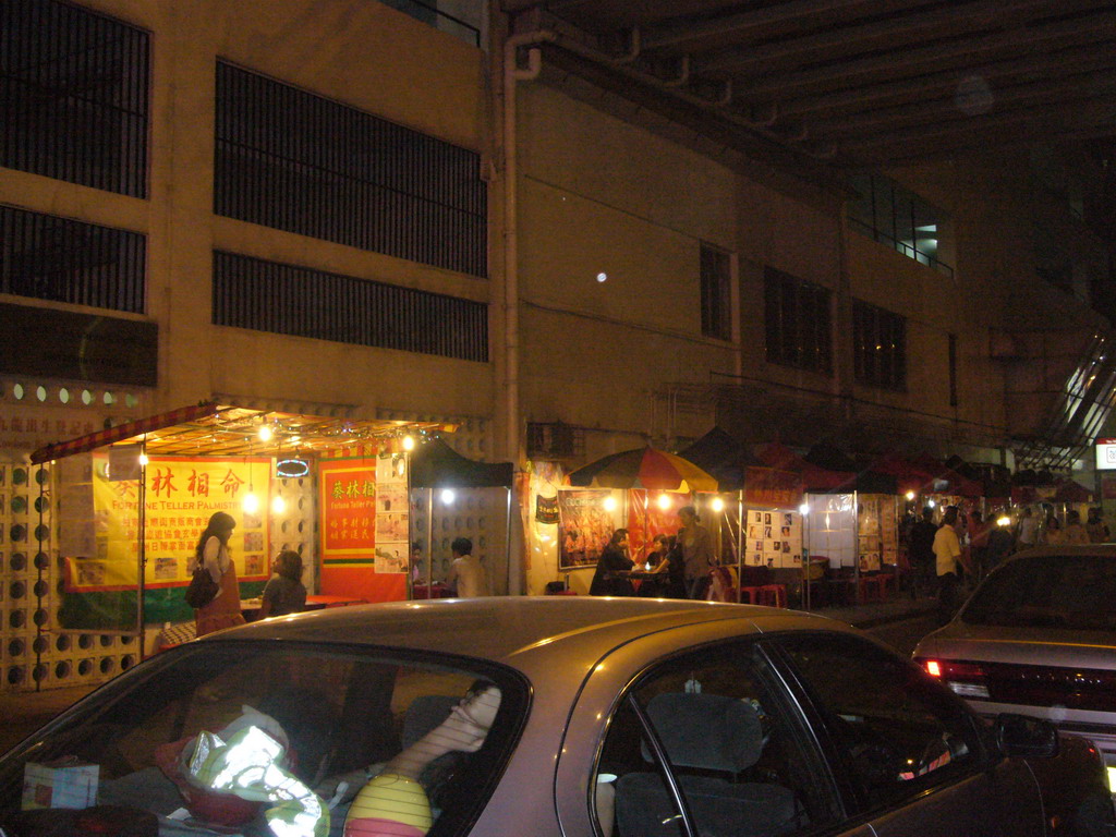 Market stalls in a street at Kowloon, by night