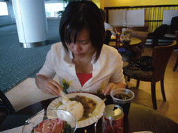 Miaomiao having brunch in a restaurant at Hong Kong International Airport