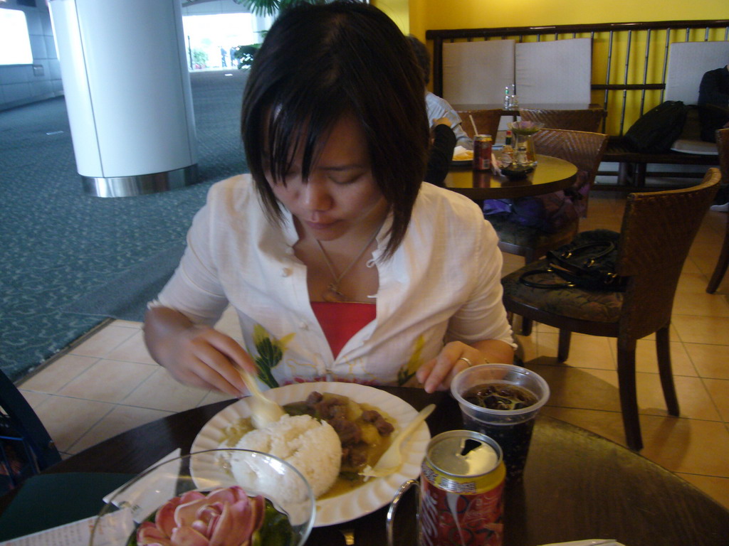 Miaomiao having brunch in a restaurant at Hong Kong International Airport