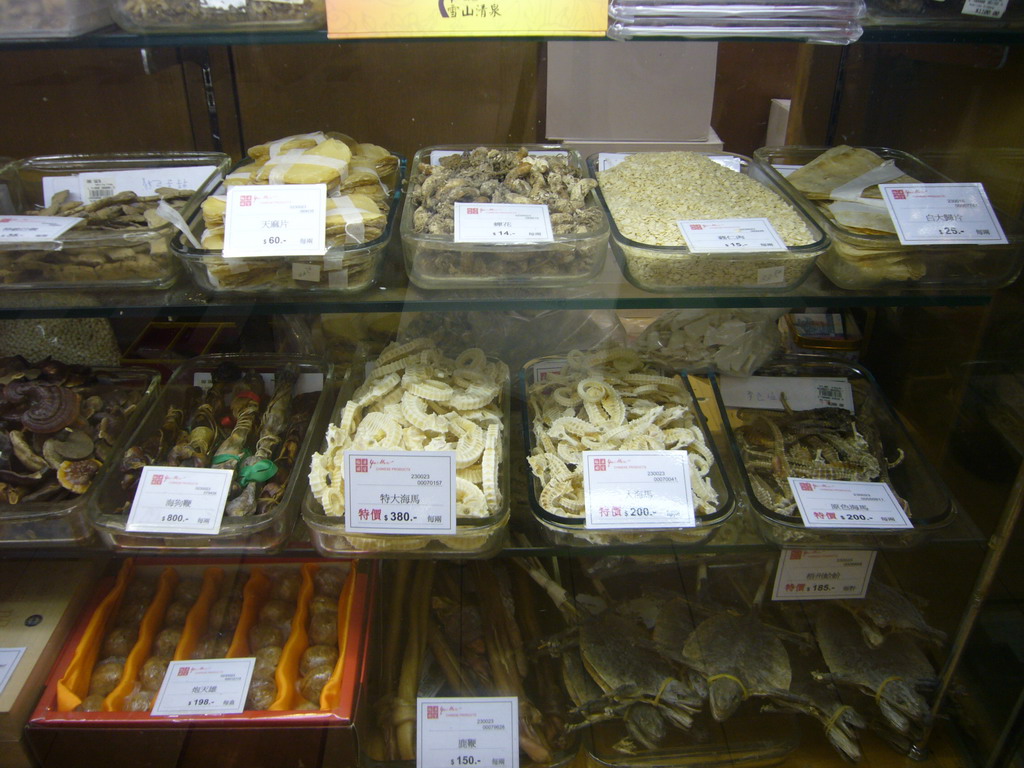 Dried seahorses and other food in a shop at Kowloon, by night